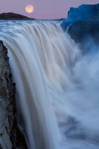 A super moon over the most powerful waterfall in Europe, Dettifoss, Iceland.