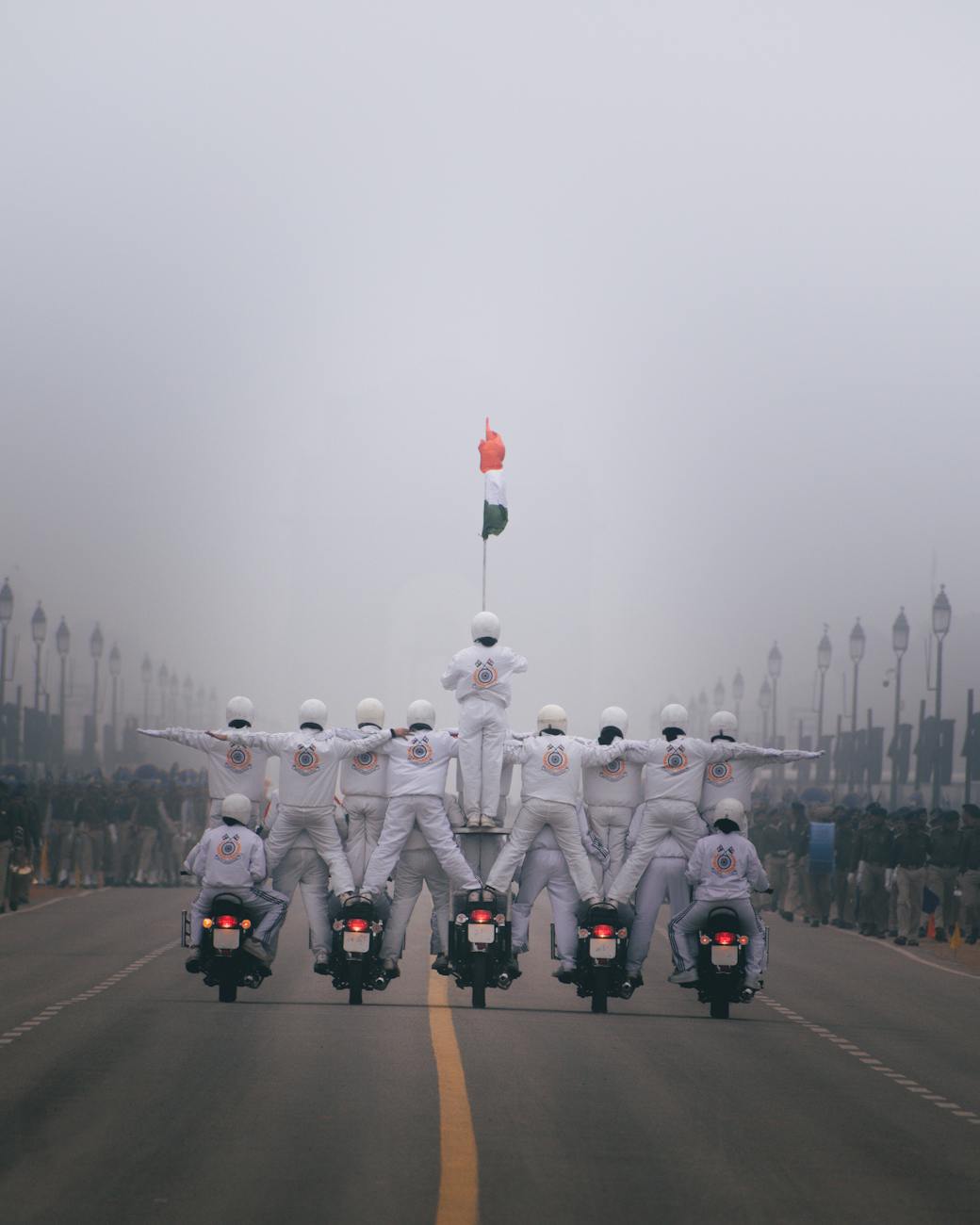 people in white uniform riding motorcycle. Republic Day celebration in India