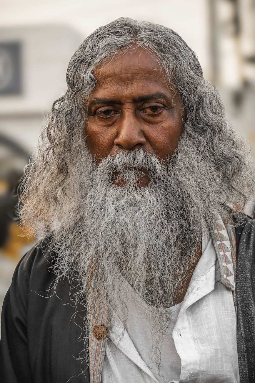 portrait of elderly man with long gray beard in kolkata