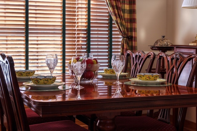 brown wooden chair near short stem clear wine-glass-vacation rentals