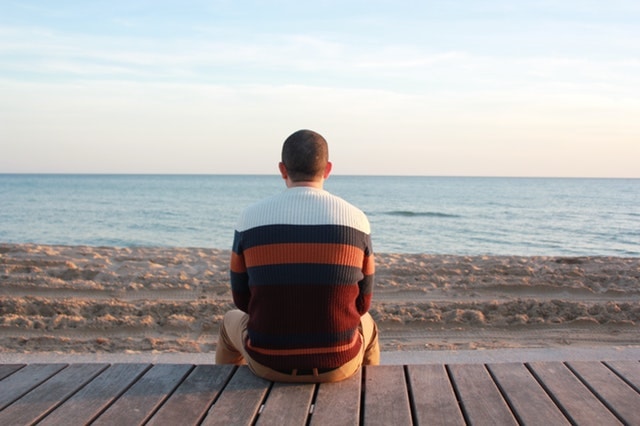 Man sitting on wooden panel-Vacation rentals