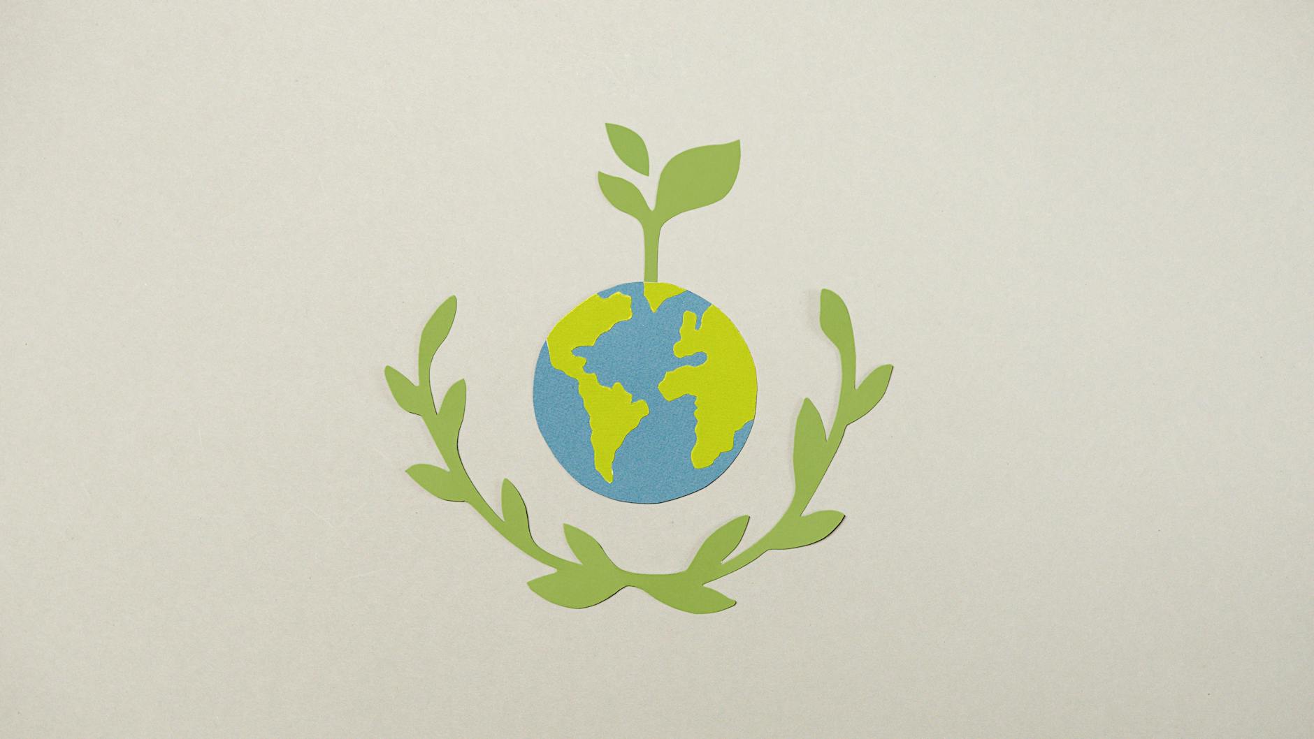 paper cutouts on a gray surface on Earth day