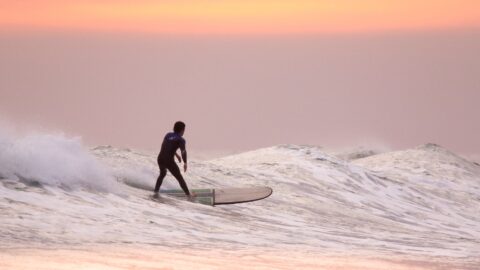 man doing surfing at golden hour