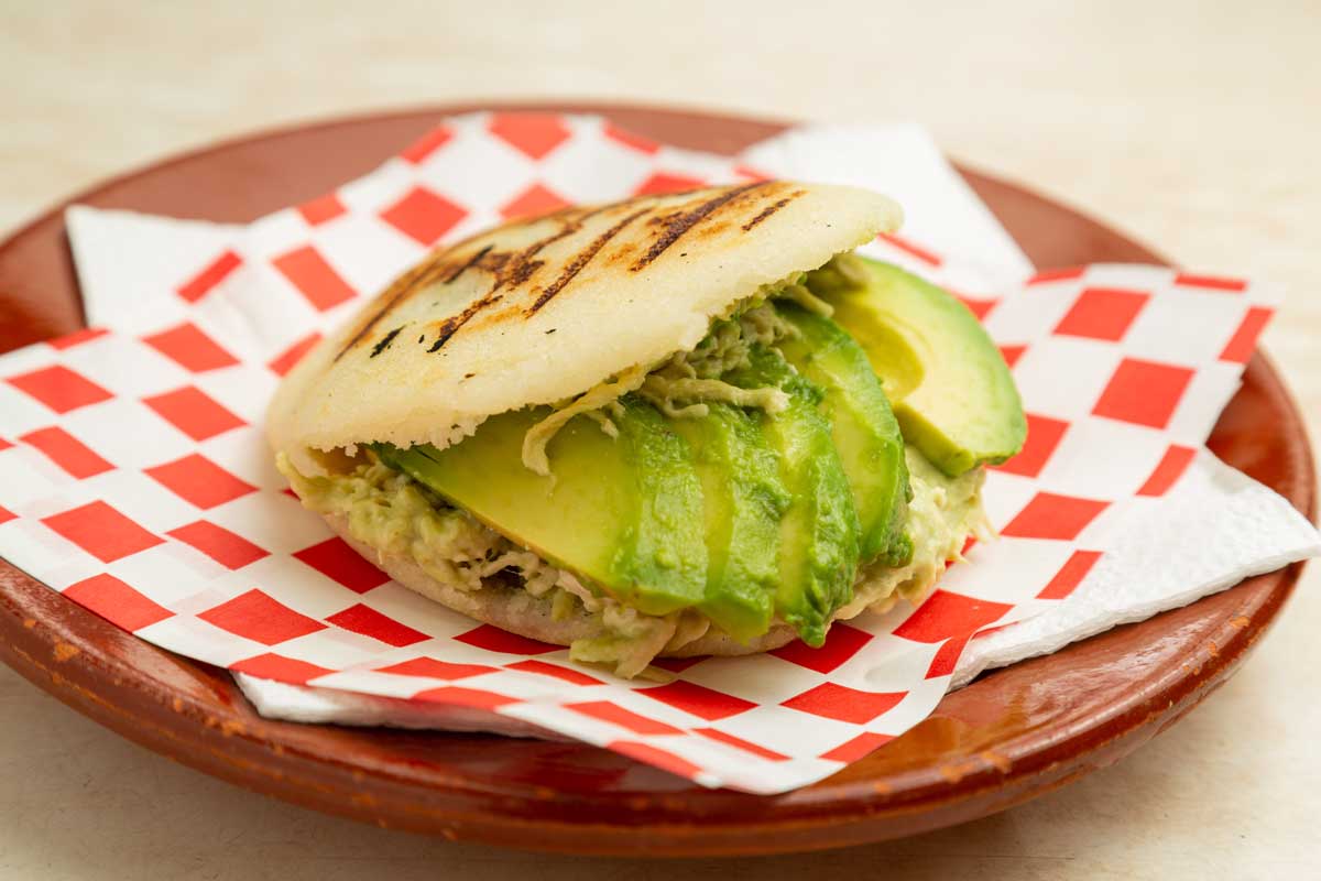 Caracas street food Reina Pepiada arepa