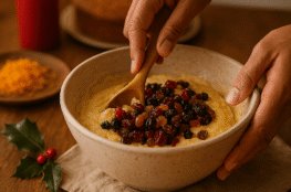 Cake mixing ceremony in Mumbai kitchen with dried fruit and spices