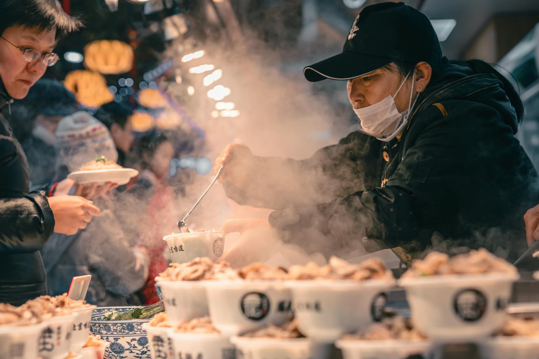 Japanese man selling food in cups
