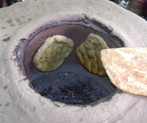 Silk Route Spring Food – traditional tandoor bread baked on the walls of a clay oven