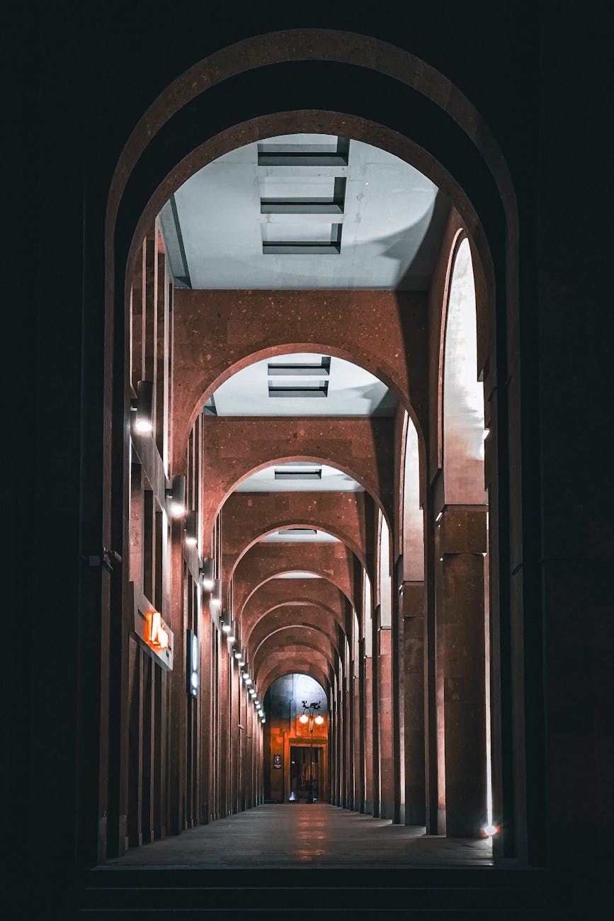 architectural night view of arched corridor in yerevan. Pink tuff architecture Armenia writers retreat atmosphere