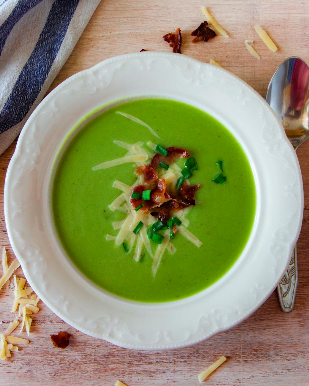 green soup dish on white ceramic bowl. Silk Route Spring Food – herb‑rich Central Asian spring soup with fresh greens