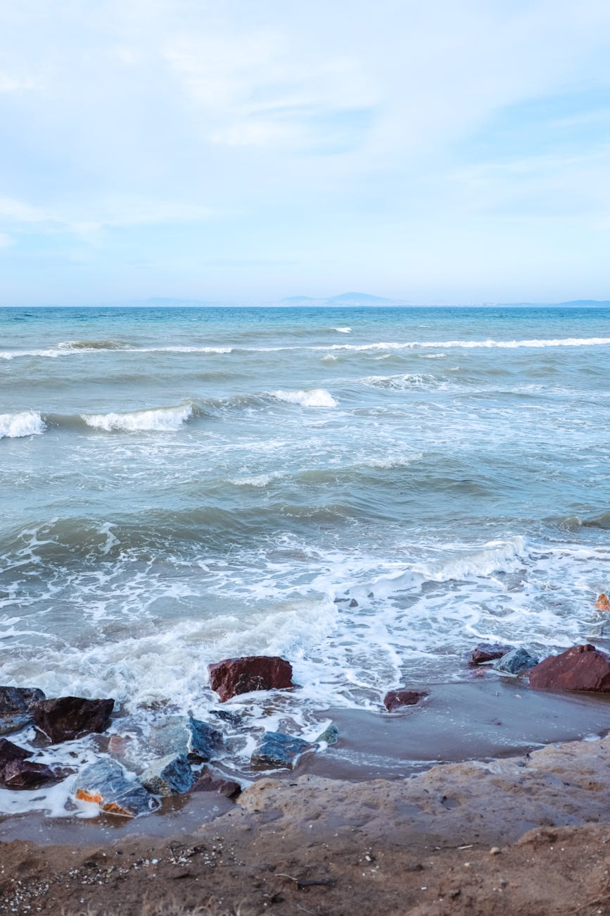 waves on a beach. Caspian Sea waves on a quiet shoreline under soft morning light.