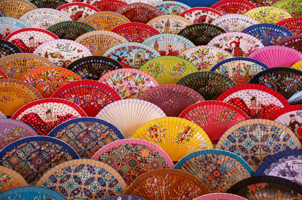 a display of hand fans in assorted colors and design