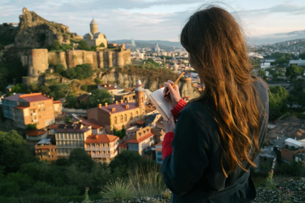 woman writing on a notebook