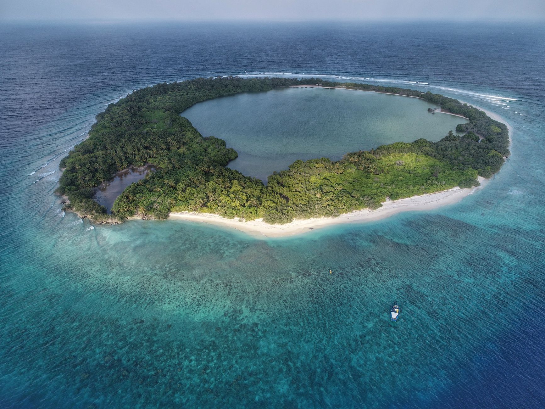 aerial photography of green island. El Niño monsoon break snorkeling India Neil Island lagoon clarity