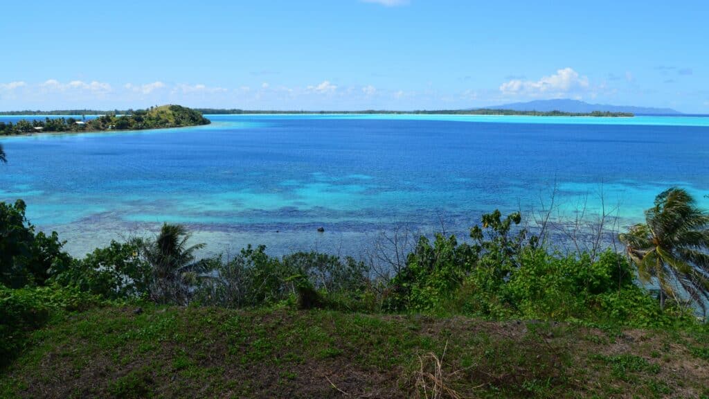 Calm blue lagoon water under soft summer light