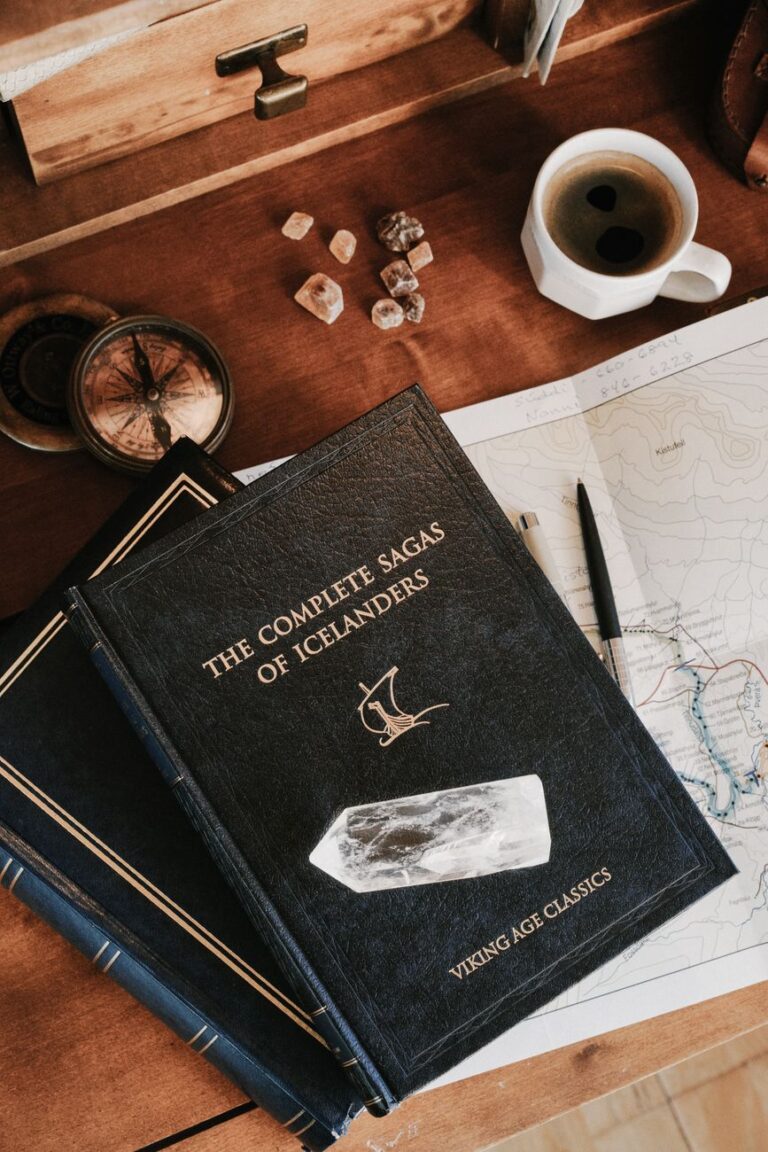 Books and a warm cup of coffee on a wooden table, reflecting the calm, quiet mood of Icelandic literature.
