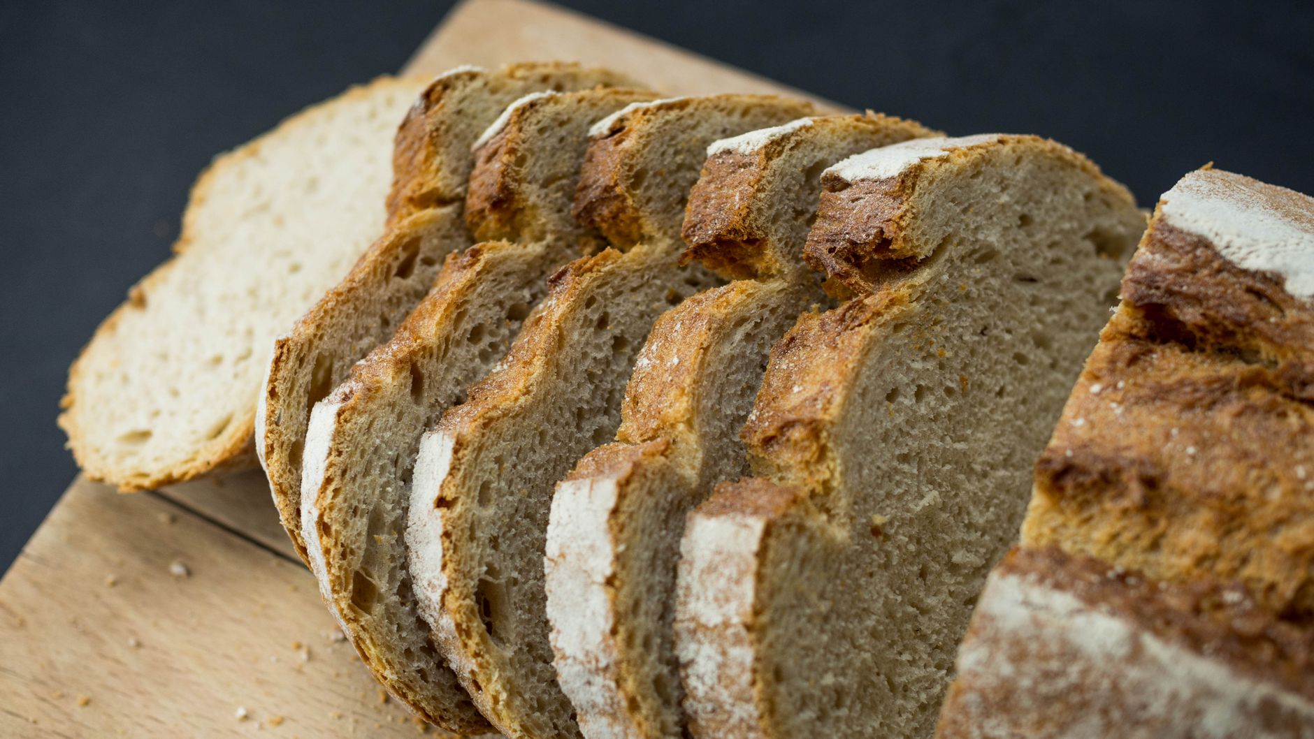 sliced brown bread on a wooden board