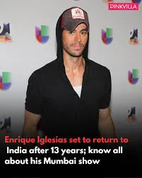 Enrique Iglesias performing live on stage, spotlight highlighting his signature romantic energy—concert teaser for Mumbai 2025